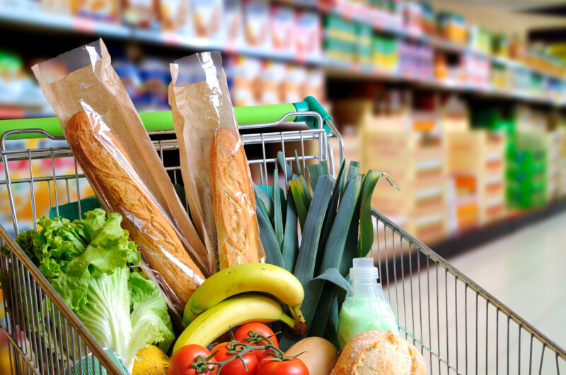 shopping cart in grocery store full of heart healthy food