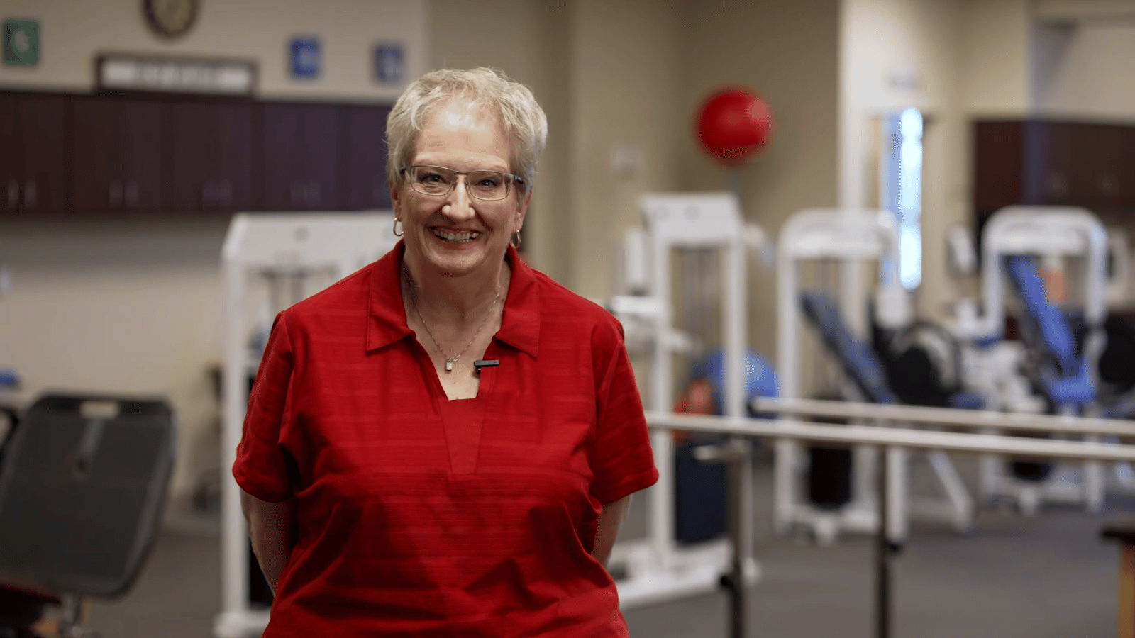 Rehab patient standing in rehabilitation facility