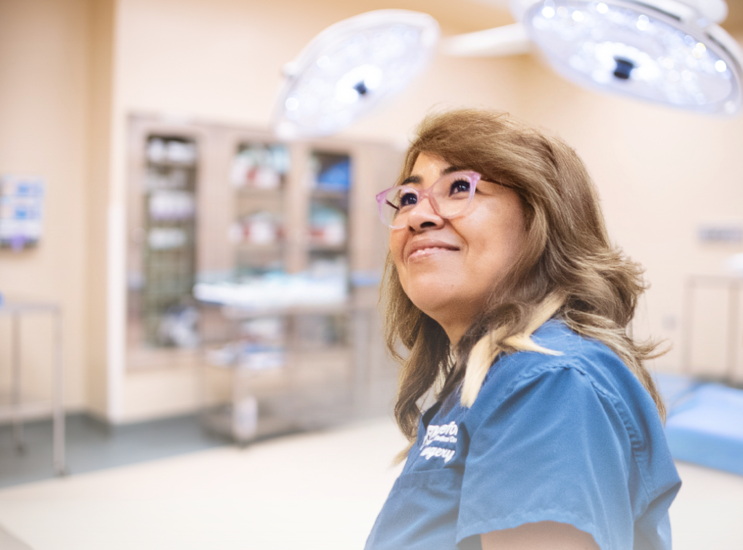 nurse smiling in operating room
